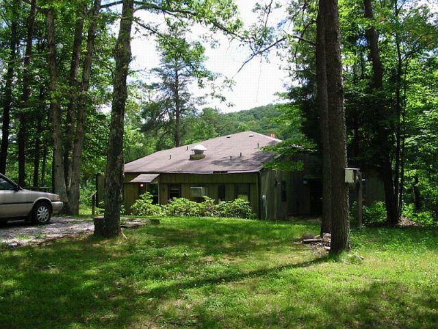 Lodge seen from gravel road approach